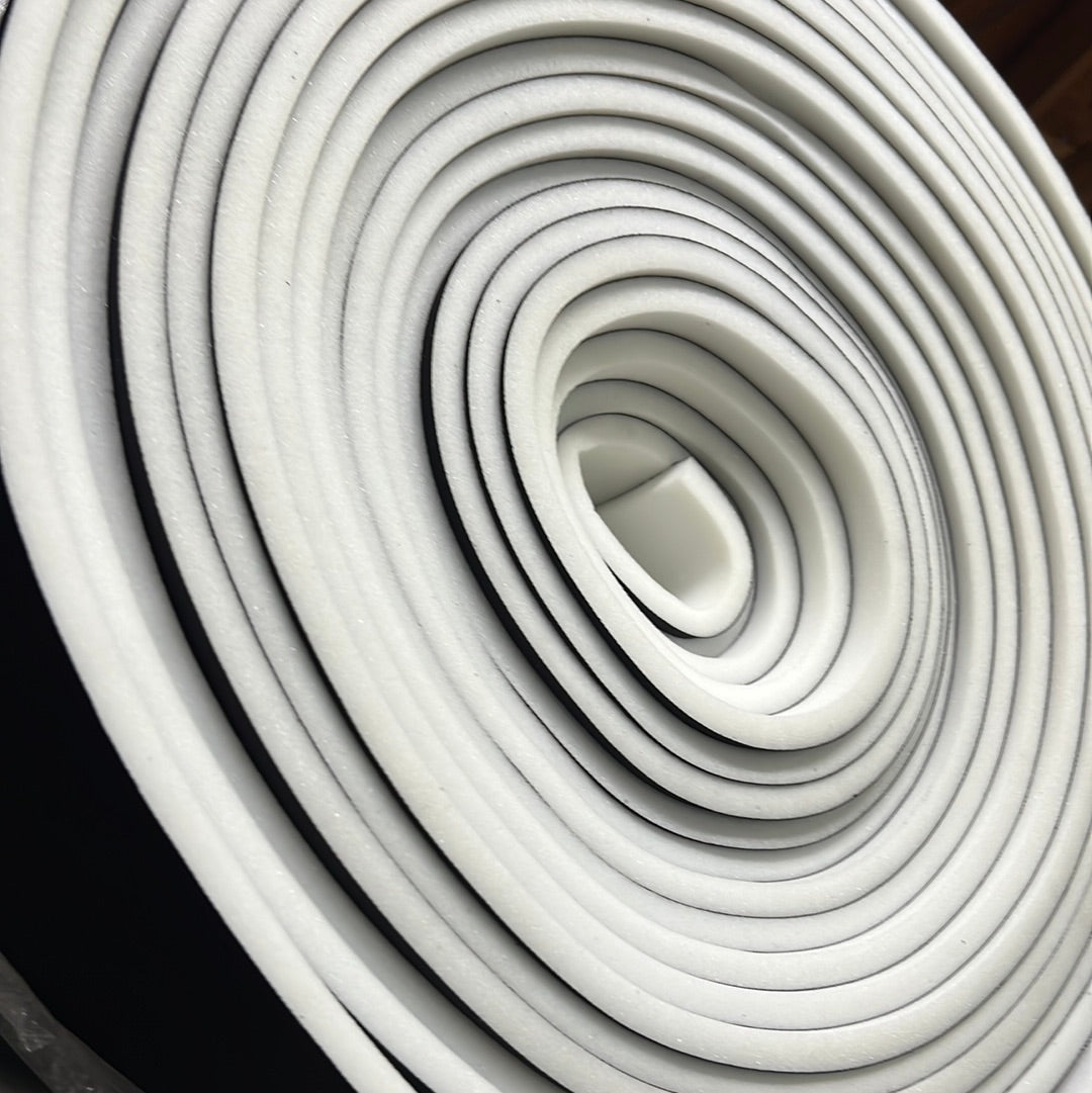 1/2" sew foam roll: white foam with black edging.