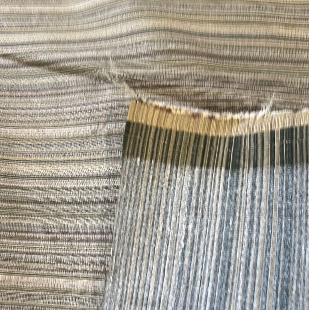 Close-up of Ebbtide Limestone fabric showcasing its subtle striped texture and neutral color palette.