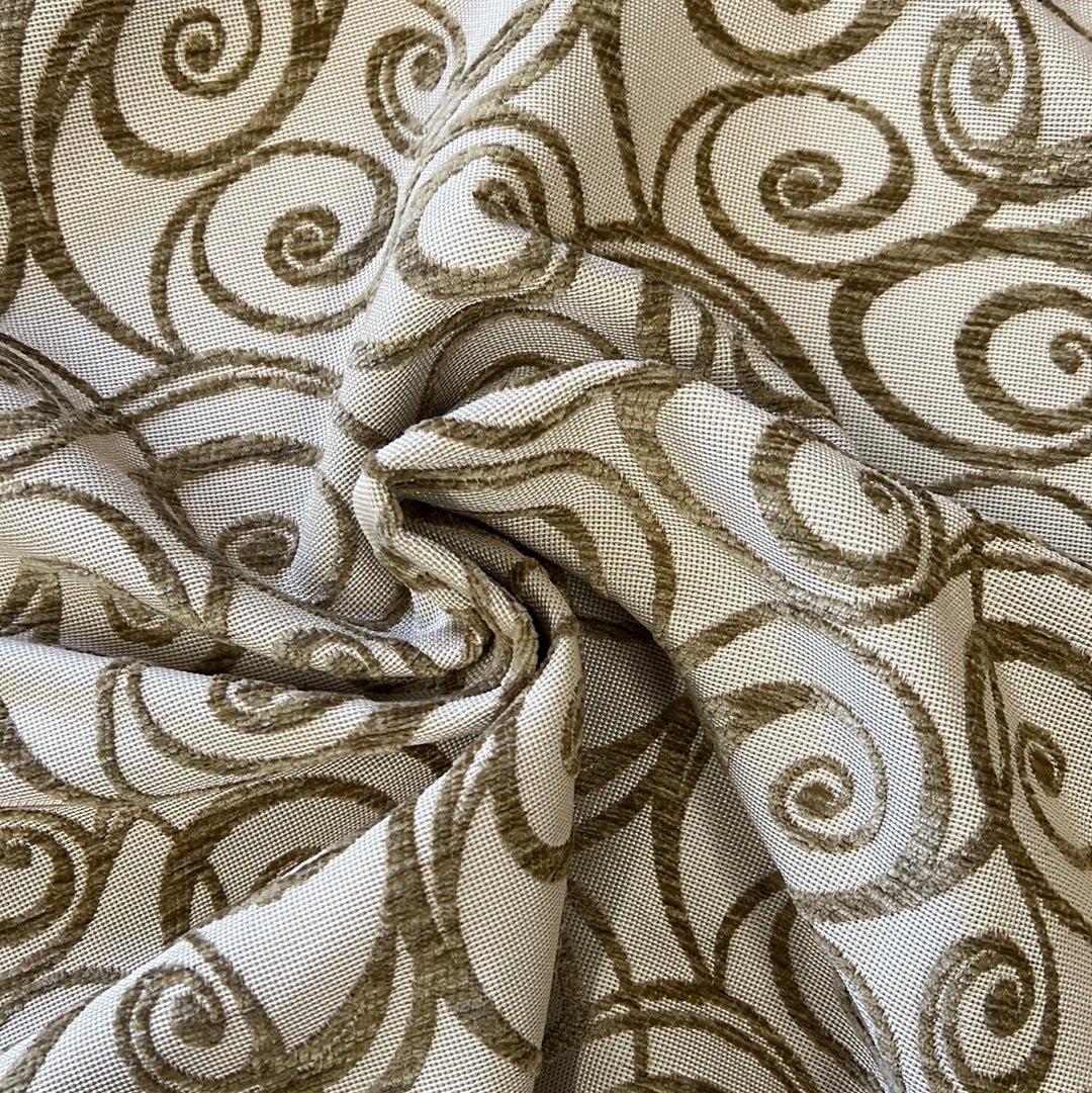 Beige fabric with embossed brown Art Nouveau swirls.