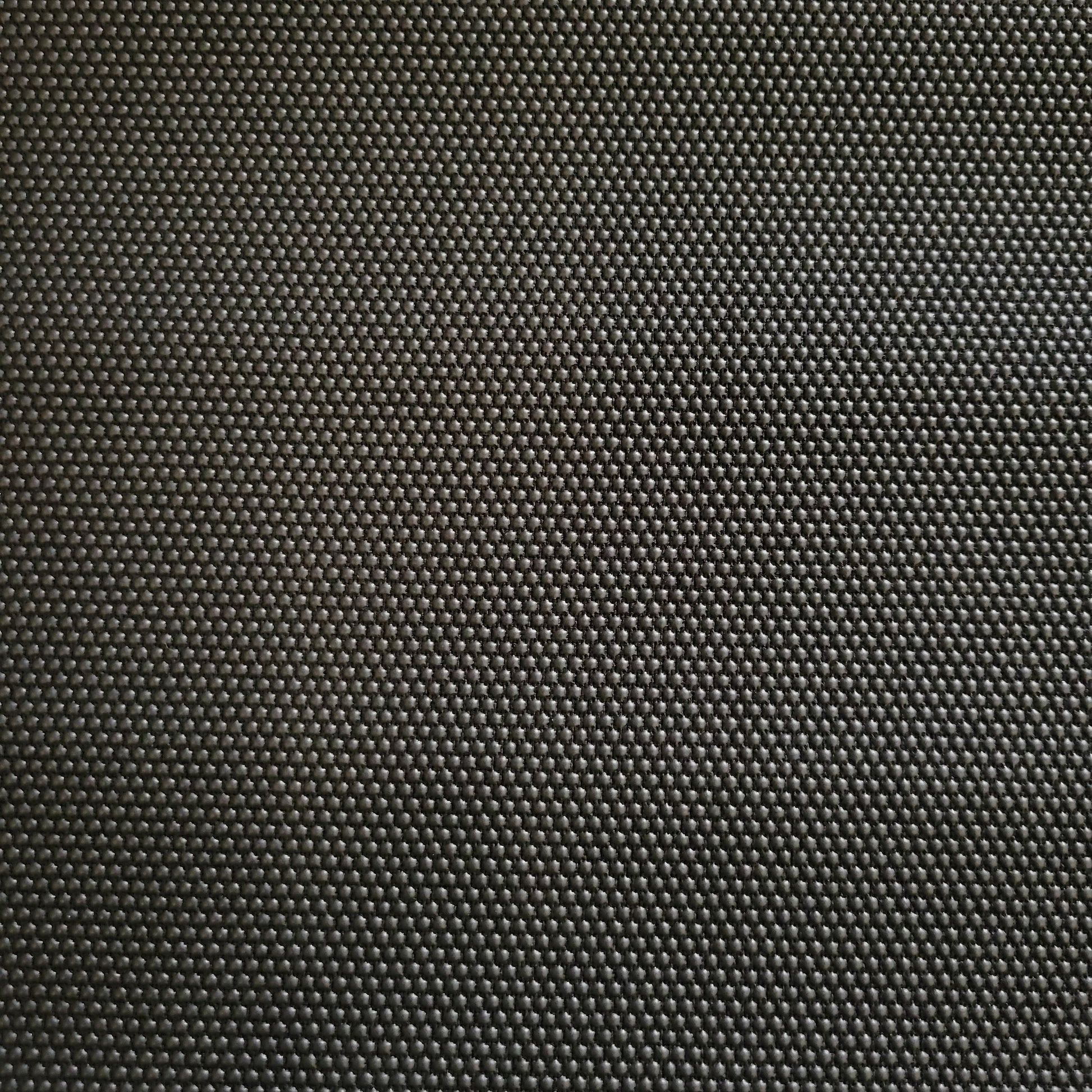 Close-up of dark gray Super Fabric 1, textured with small, raised dots.