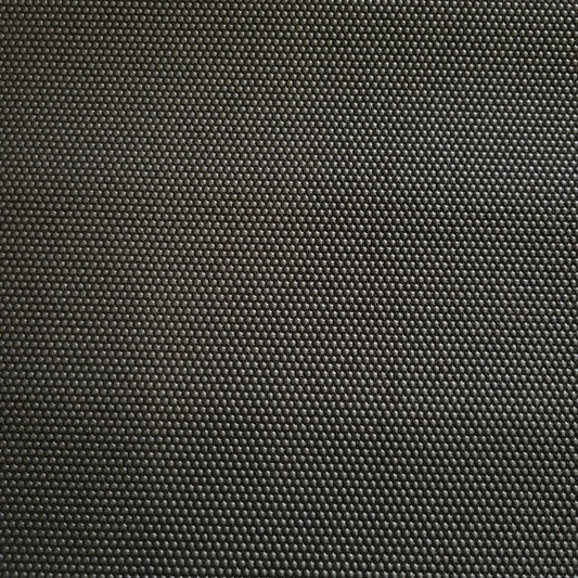 Close-up of dark gray Super Fabric 1, textured with small, raised dots.