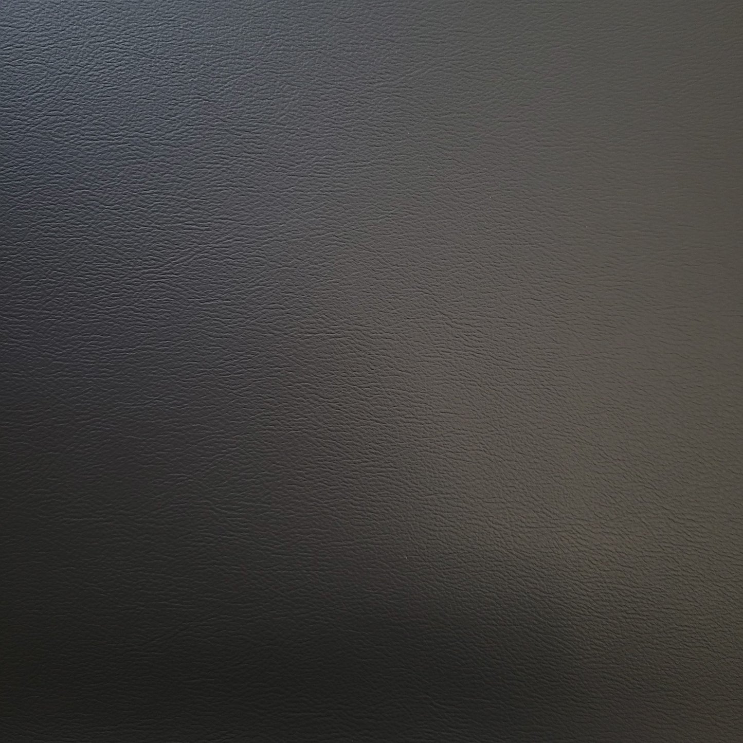 Dark gray textured vinyl sample.