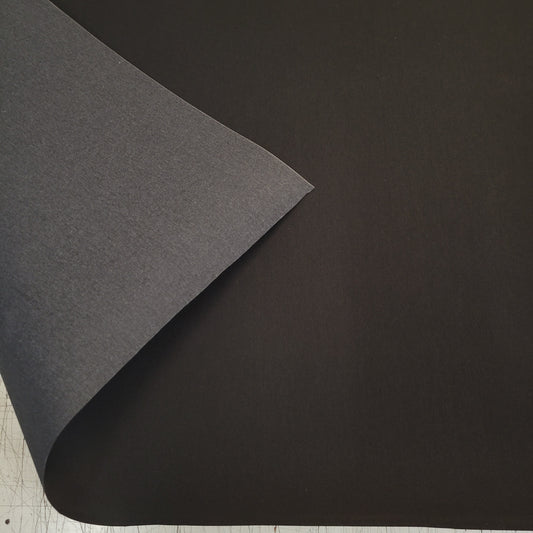 Jet Black Awning fabric sample: Durable, dark-colored material ideal for outdoor shade.