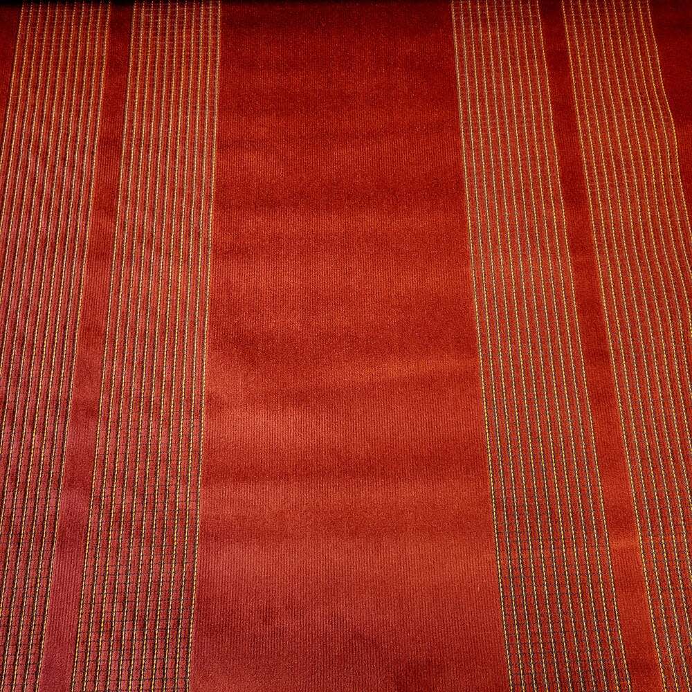 Red upholstery fabric sample with subtle gold vertical stripes.