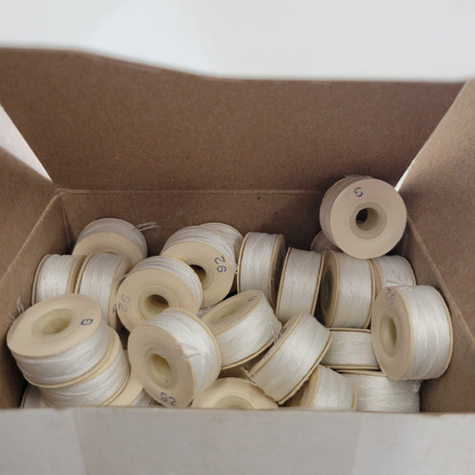 Sunguard 92G Natural White Bobbins 201Q:  201 off-white cotton bobbins in cardboard box.