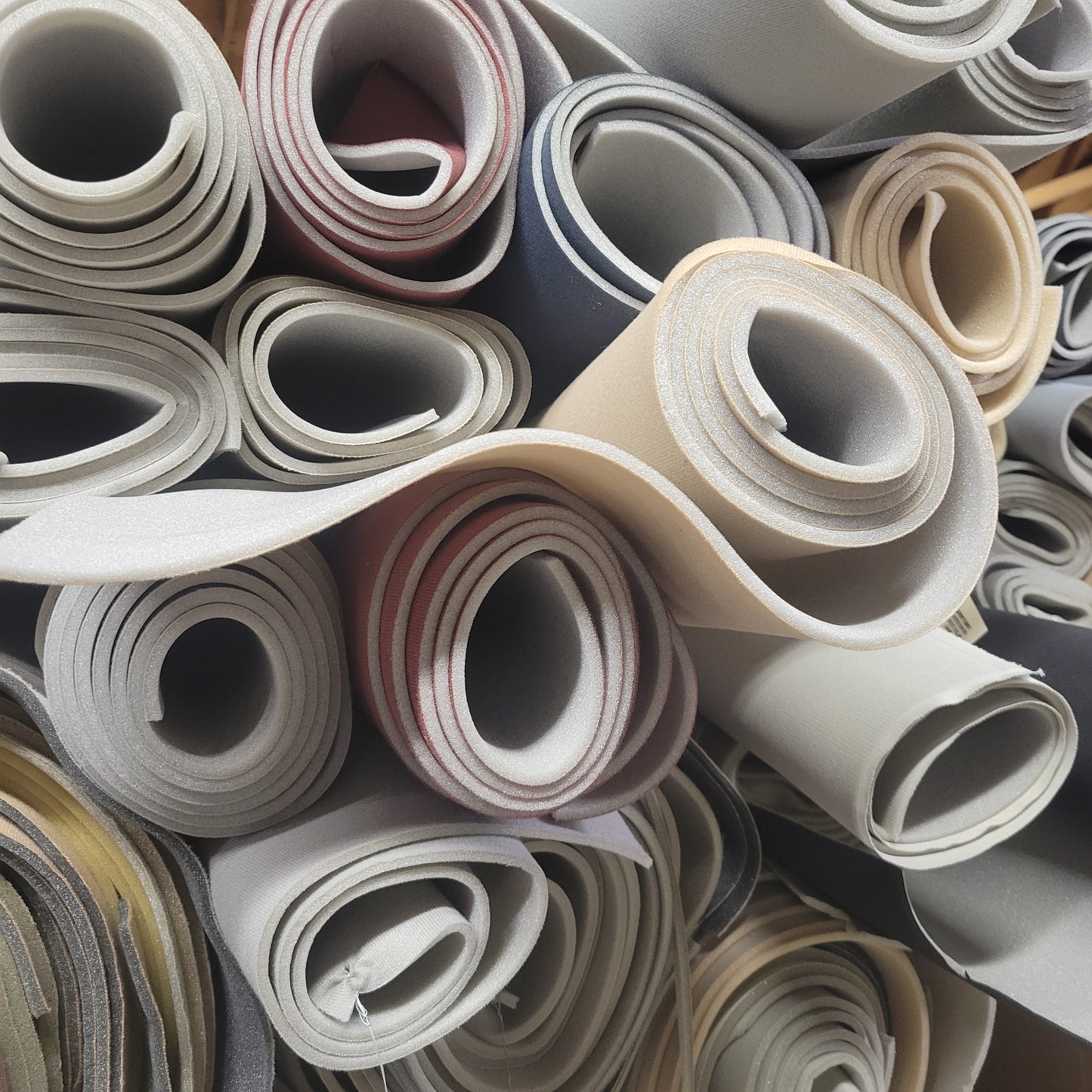 Headliner Scrap 3/16" Foam rolls in various colors.