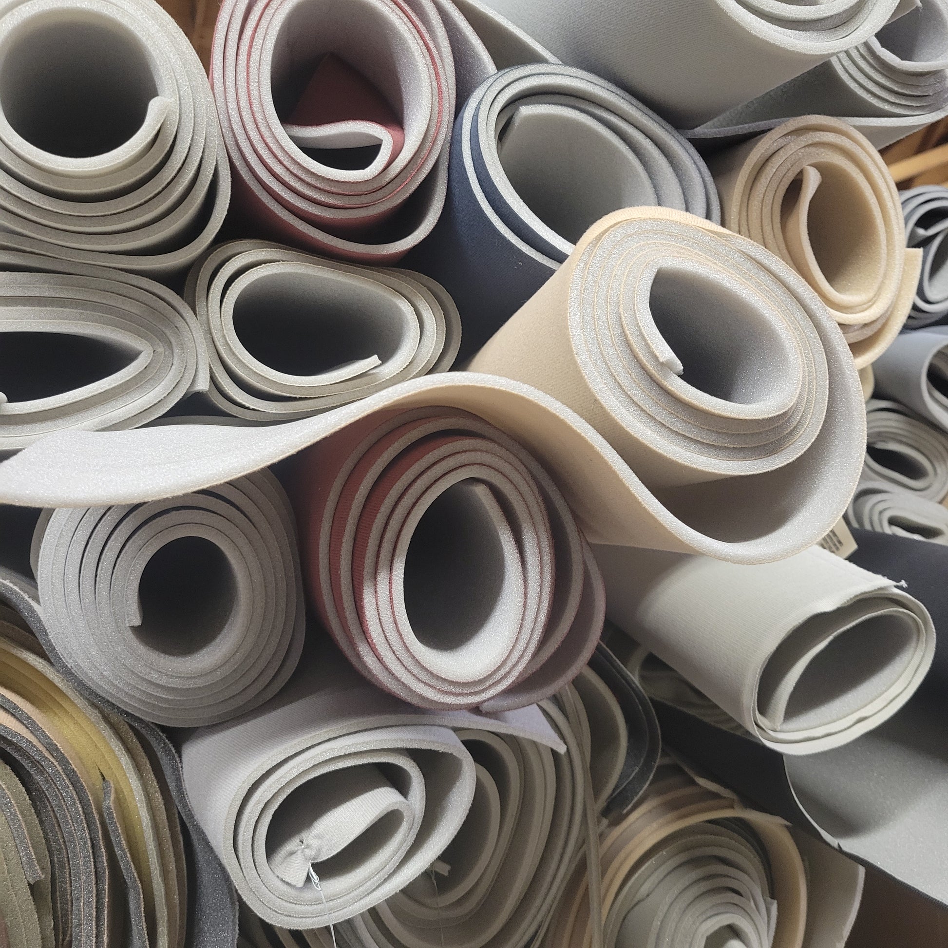 Headliner Scrap 3/16" Foam rolls in various colors.