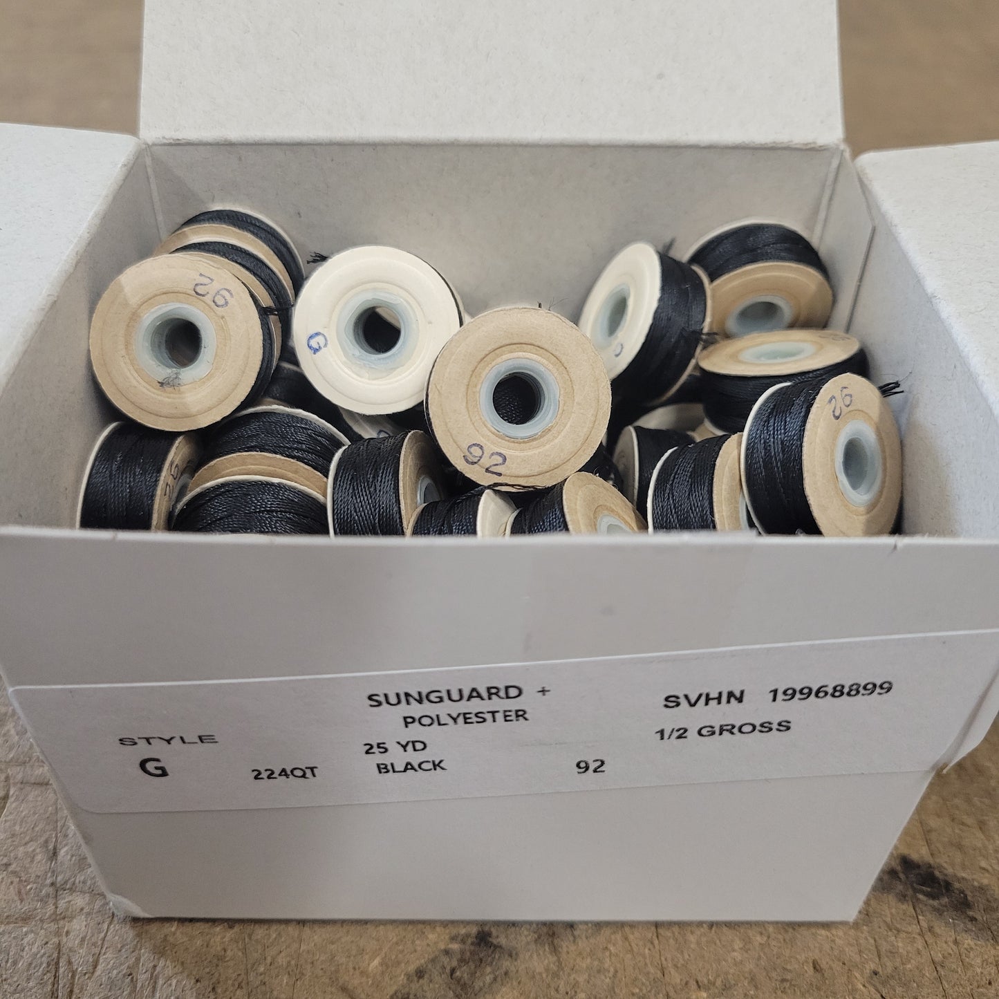 Sunguard 92G Sol. Dyed Black Bobbins 224QT: 1/2 gross, 25-yard spools of black polyester thread.