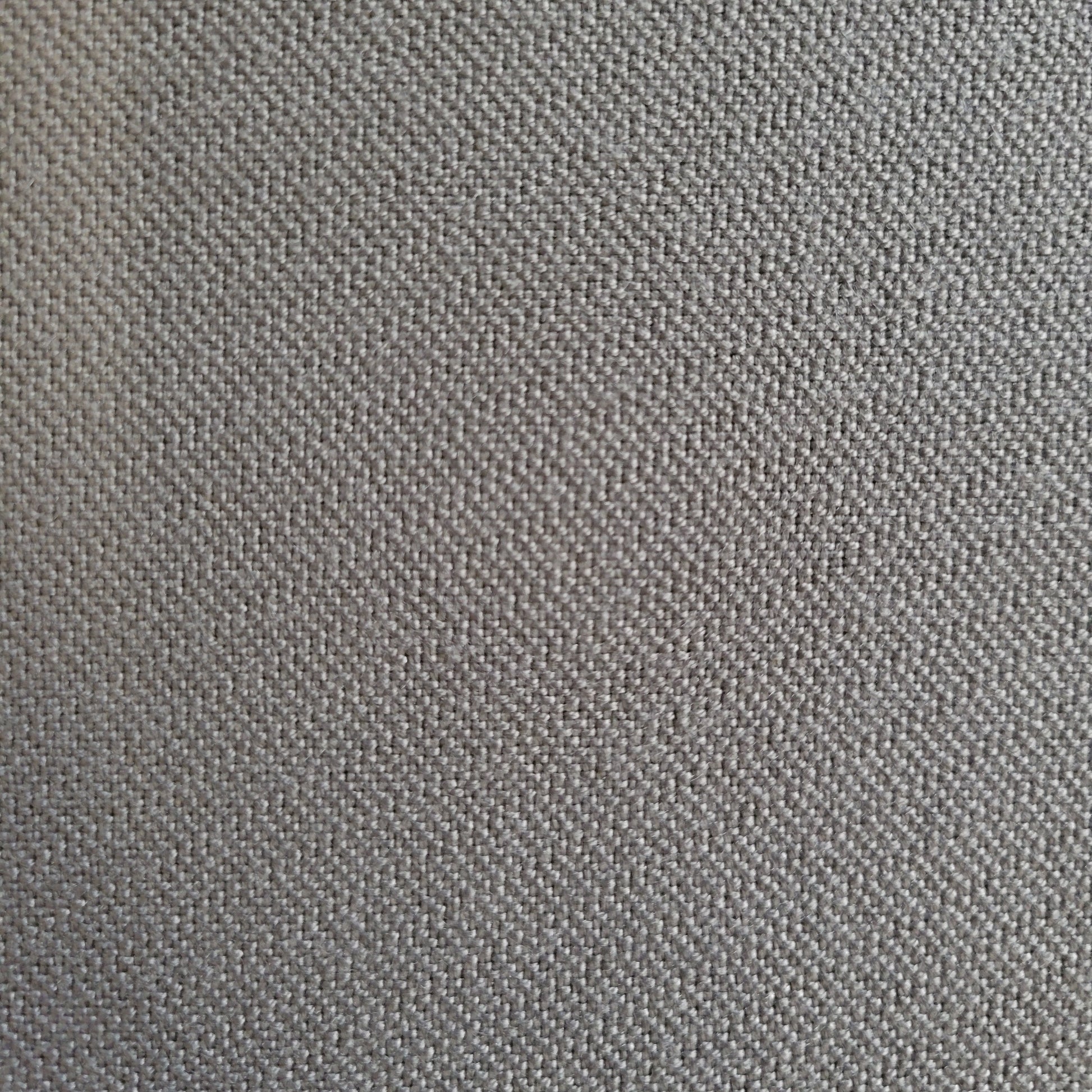 Close-up of gray fabric texture, showing subtle weave detail.
