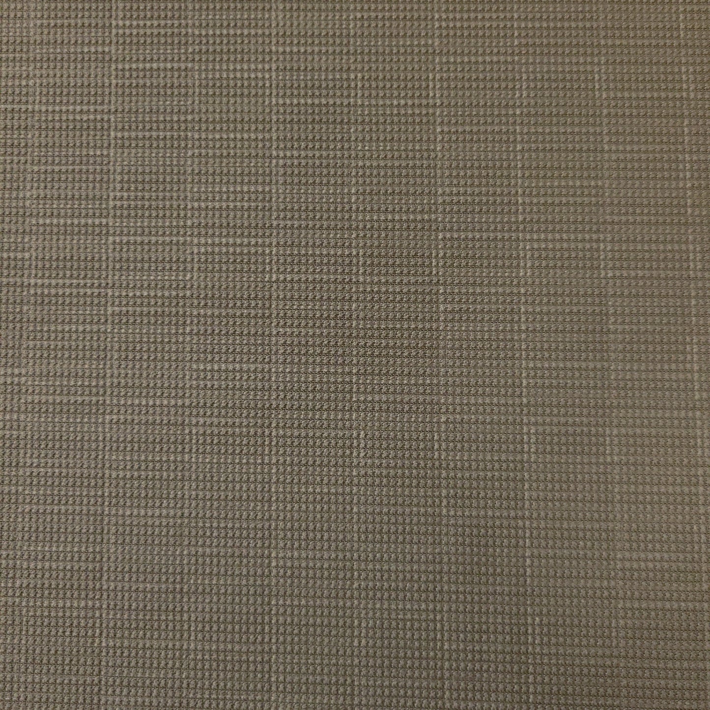 Close-up of neutral-toned textured fabric swatch.