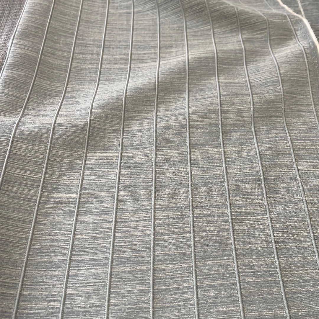 1911 Plateau fabric: Textured grey ribbed upholstery material.