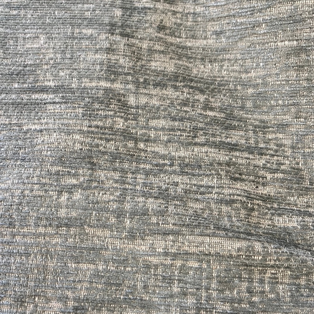 1904 Bruges Sage upholstery fabric: textured grey textile with subtle pattern.