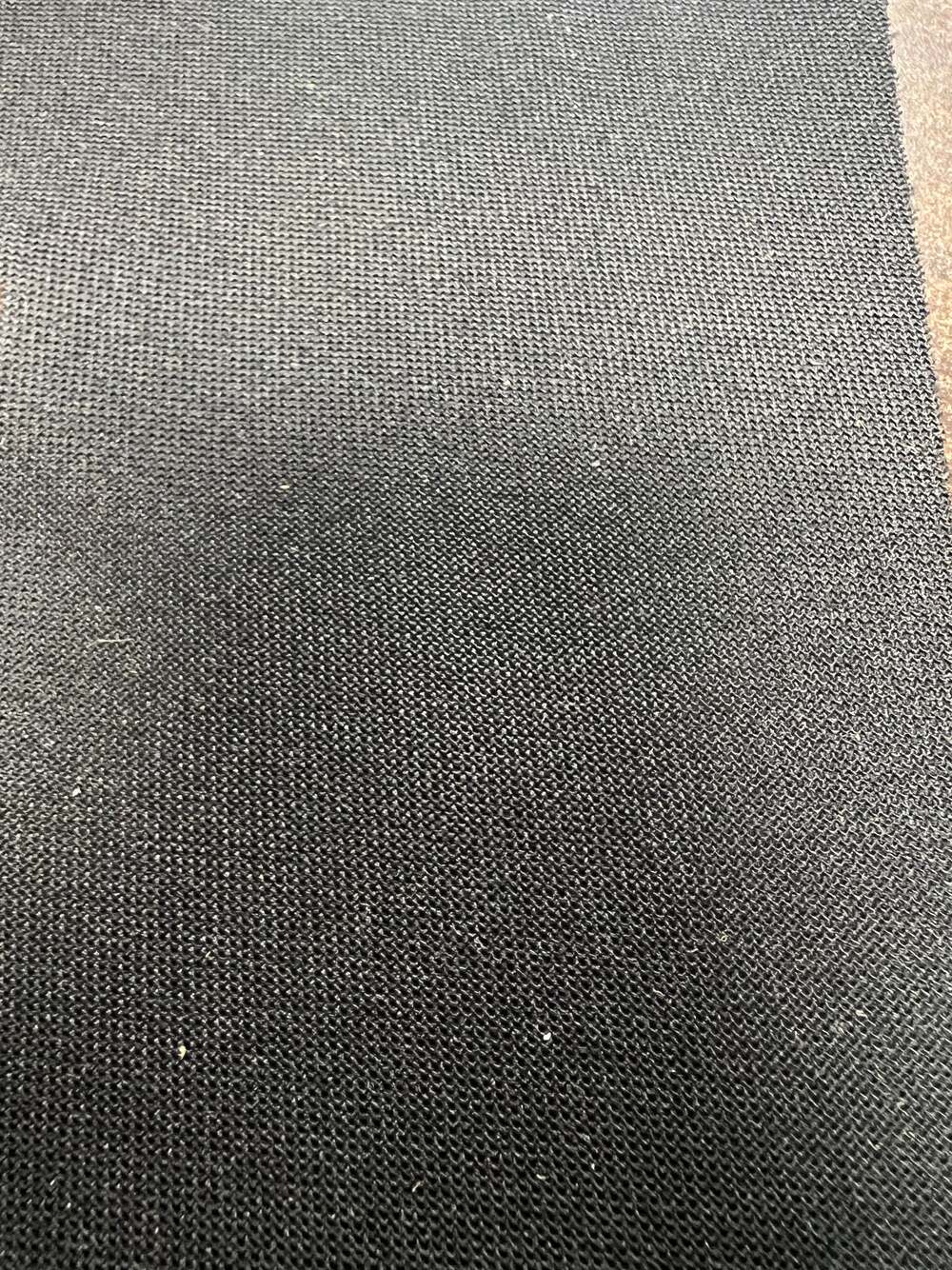 Nova Ebony Ford Seat fabric, 18.18113: Dark gray textured automotive upholstery.