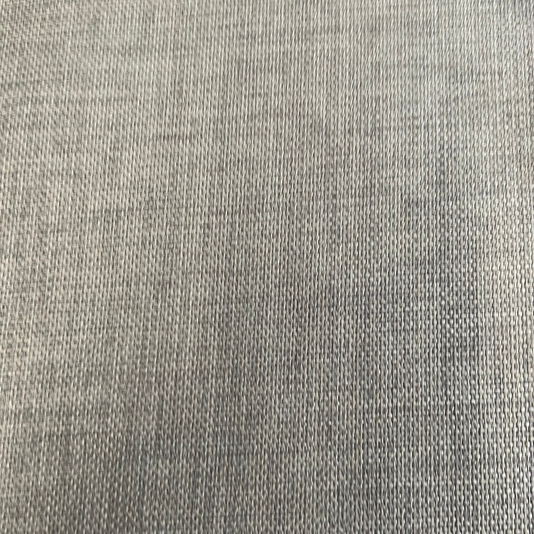 Close-up of neutral-toned upholstery fabric with subtle texture.
