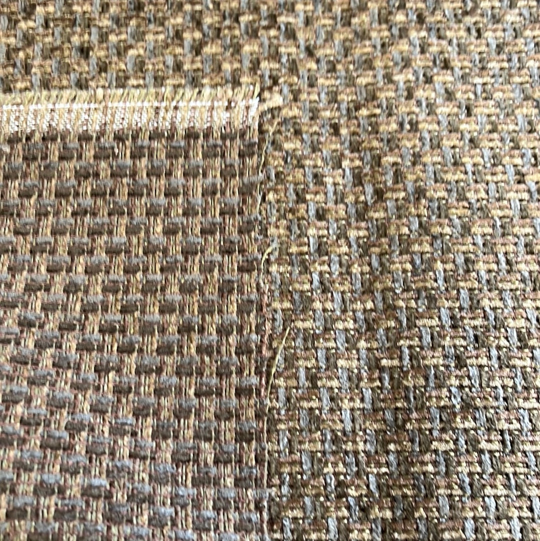 Close-up of woven upholstery fabric in olive and brown hues, showing textured detail.