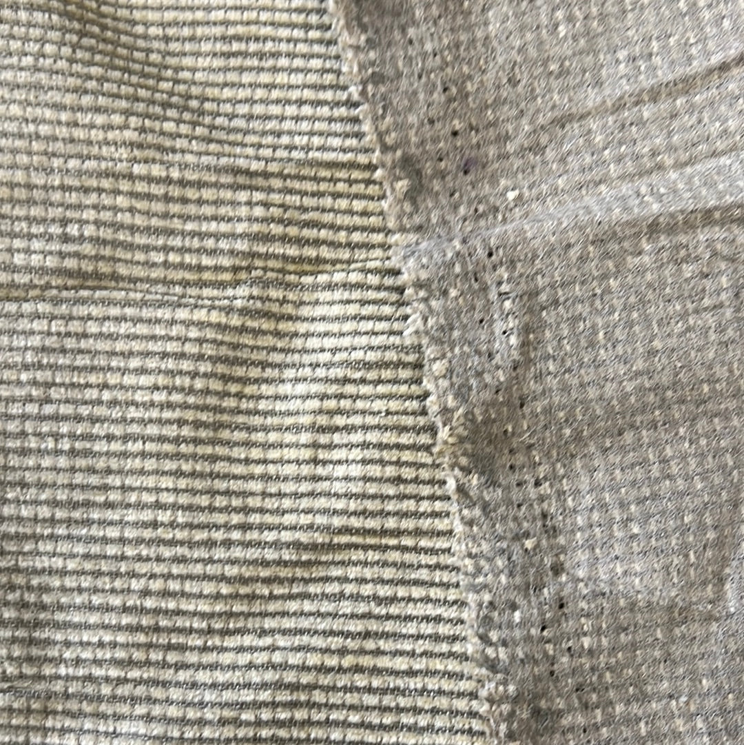 Close-up of textured fabric swatches, showing subtle variations in weave and color.