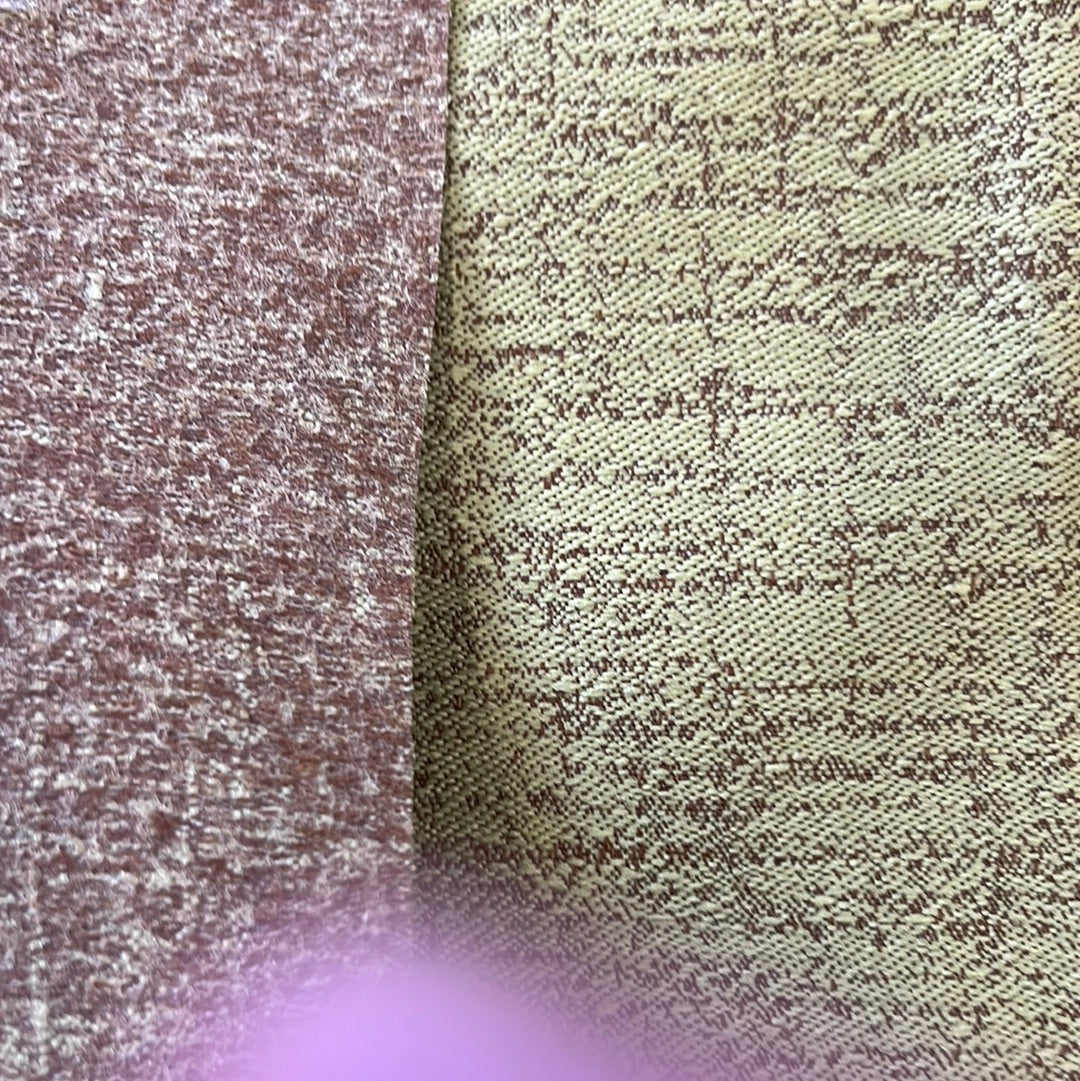 Close-up of two fabric swatches: a mottled brown and a beige with a subtle pattern.