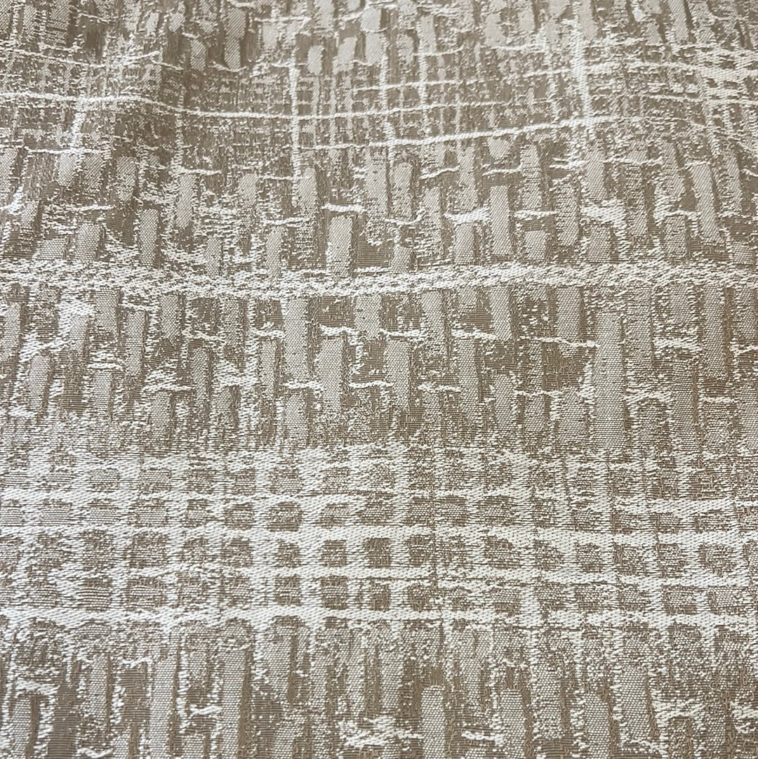 Beige fabric swatch showcasing an embossed, textured pattern.