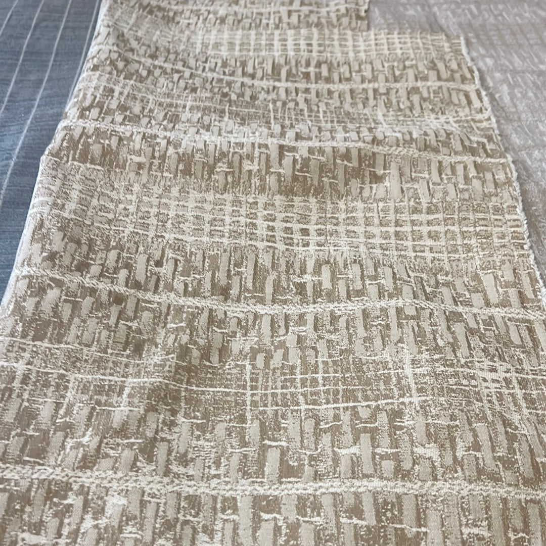 1910 Panama Gold fabric swatch: beige textured upholstery with a subtle grid pattern.
