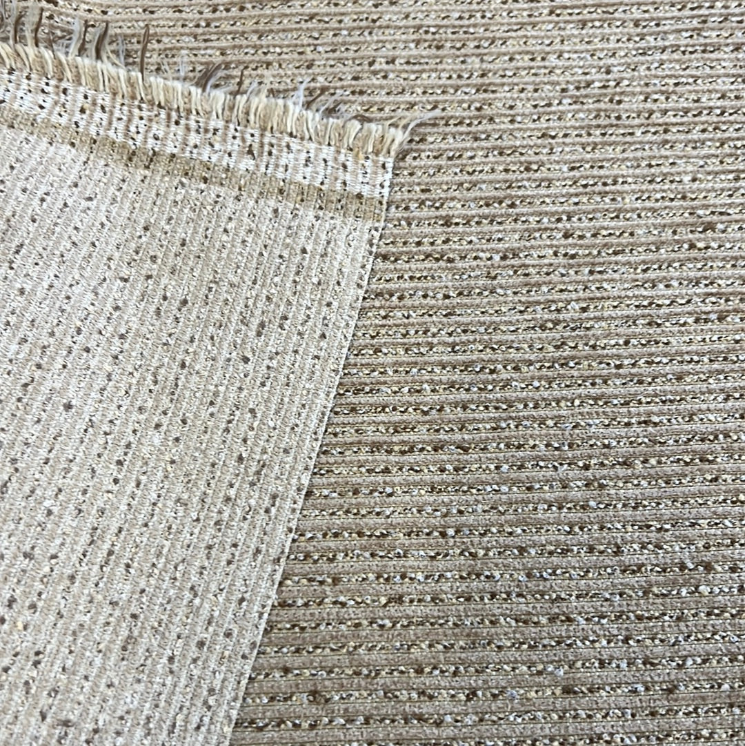 Beige textured fabric swatches, showcasing ribbed and subtly shimmering patterns.
