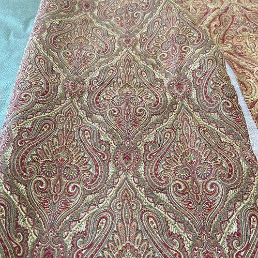 1926 Bennington Gold upholstery fabric: Red, gold, and beige paisley damask pattern.