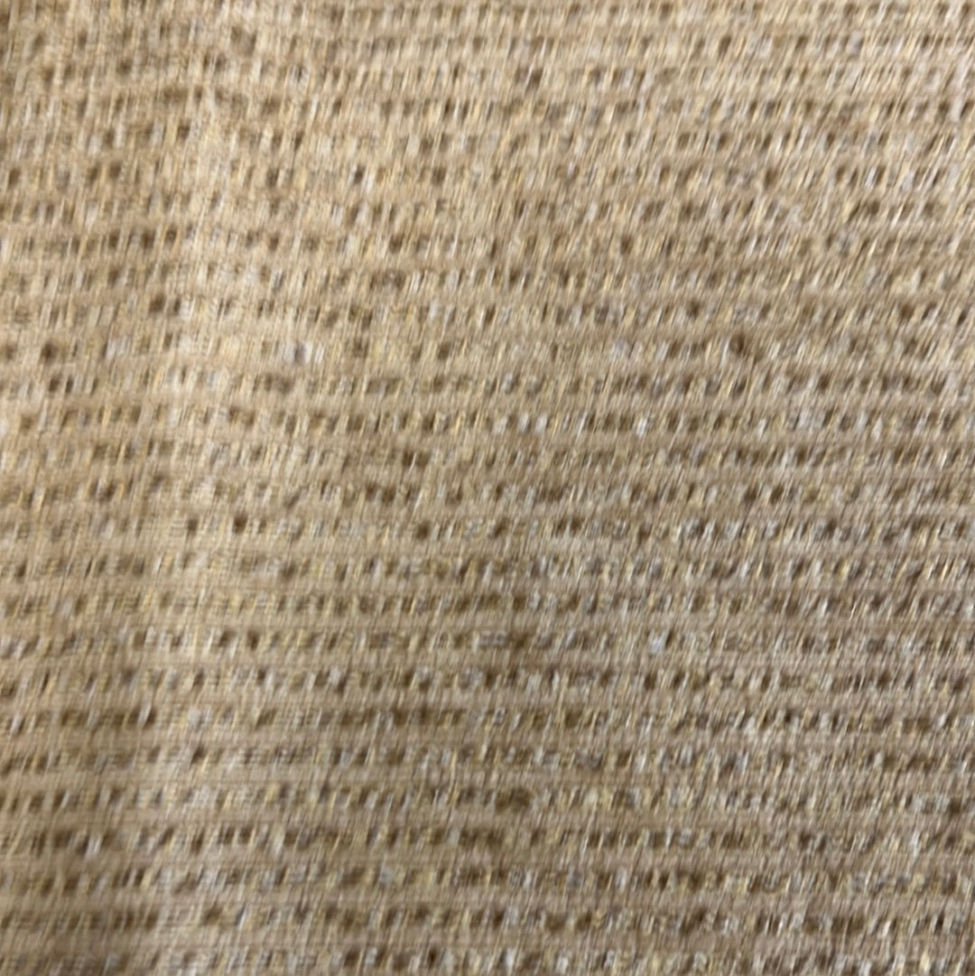 Close-up of beige fabric with subtle textural weave.