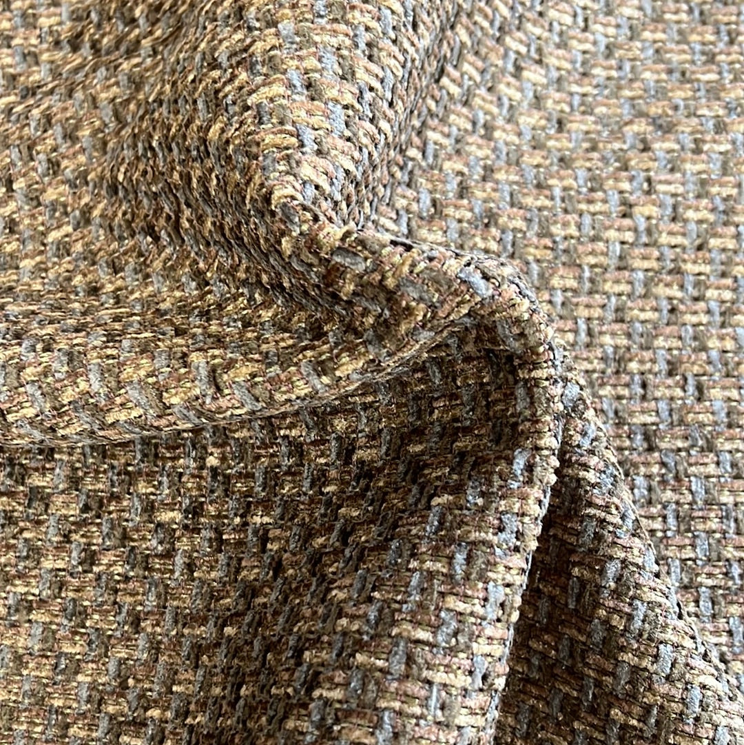 Textured olive and brown upholstery fabric swatch, close-up view.