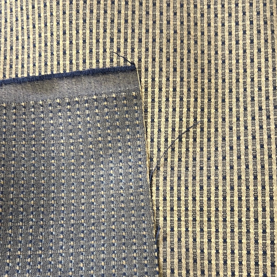 Navy and gold woven fabric swatch, close-up view showing detailed texture.
