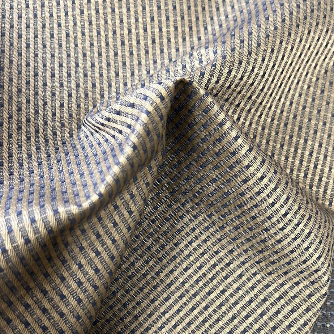 Beige and navy striped fabric swatch, fine texture.
