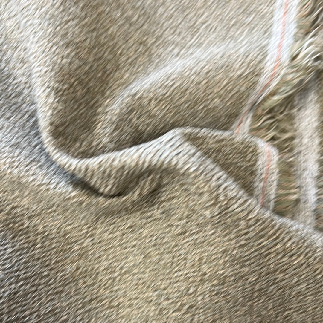 Textured taupe throw blanket with subtle fringe detail.