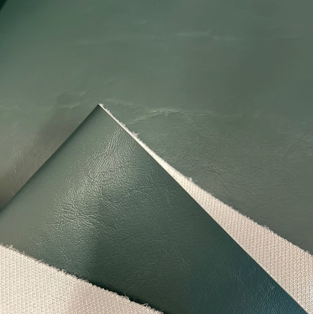 3533 Ultimate Evergreen vinyl fabric sample: sage green, textured surface.