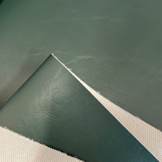 3533 Ultimate Evergreen vinyl fabric sample: sage green, textured surface.