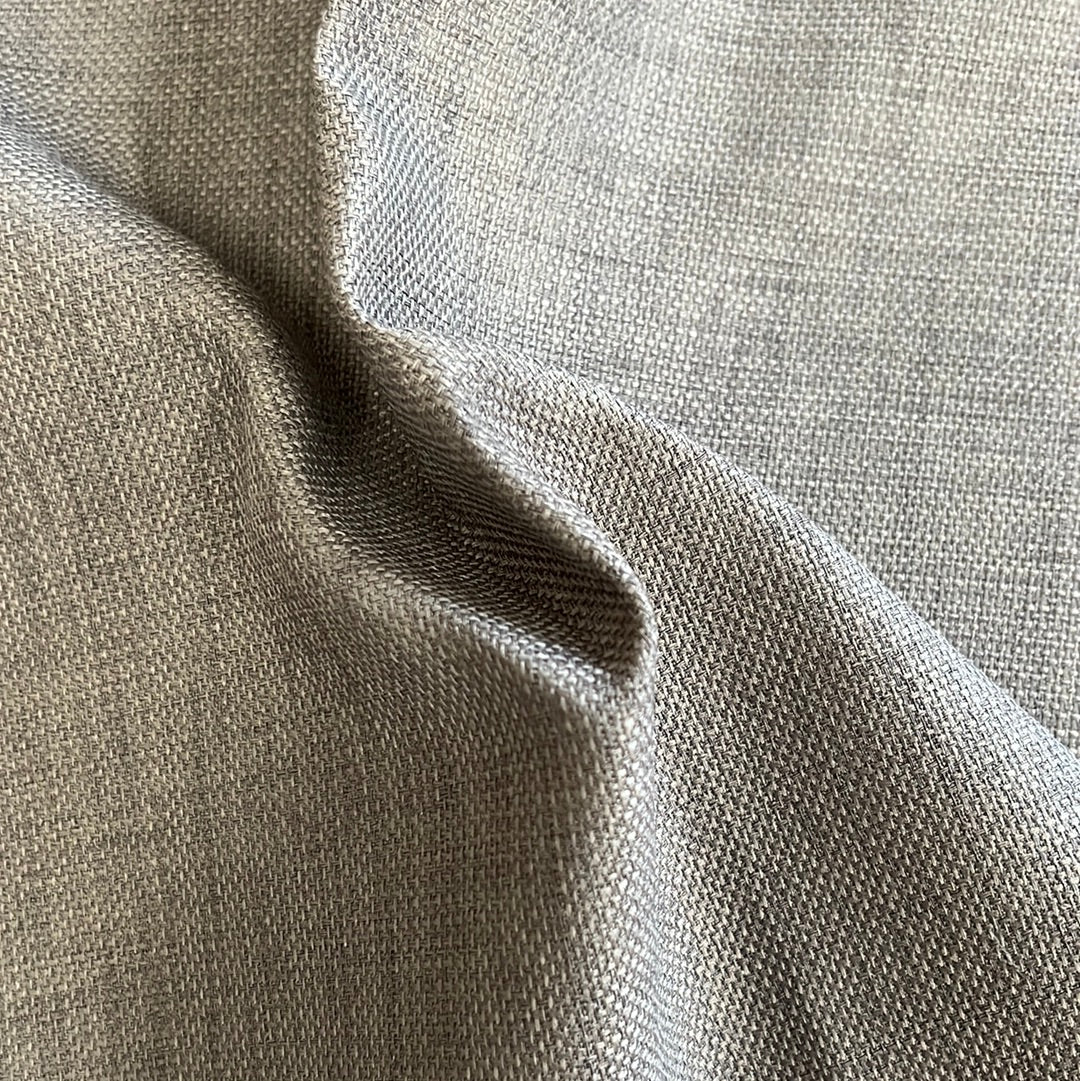Close-up of textured gray upholstery fabric, showing subtle weave detail.