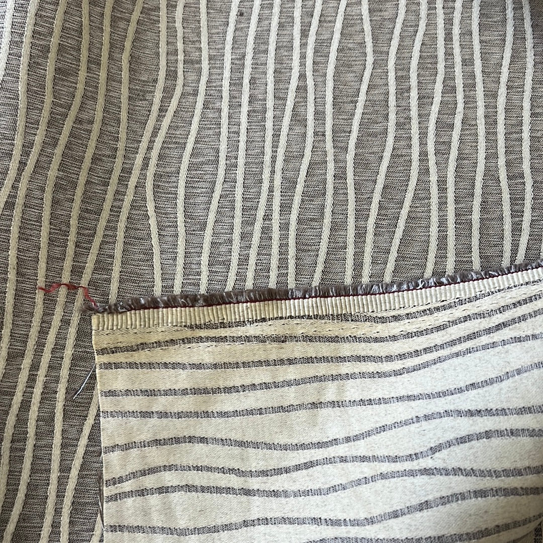 Cream and brown striped fabric swatch, showing texture and weave detail.