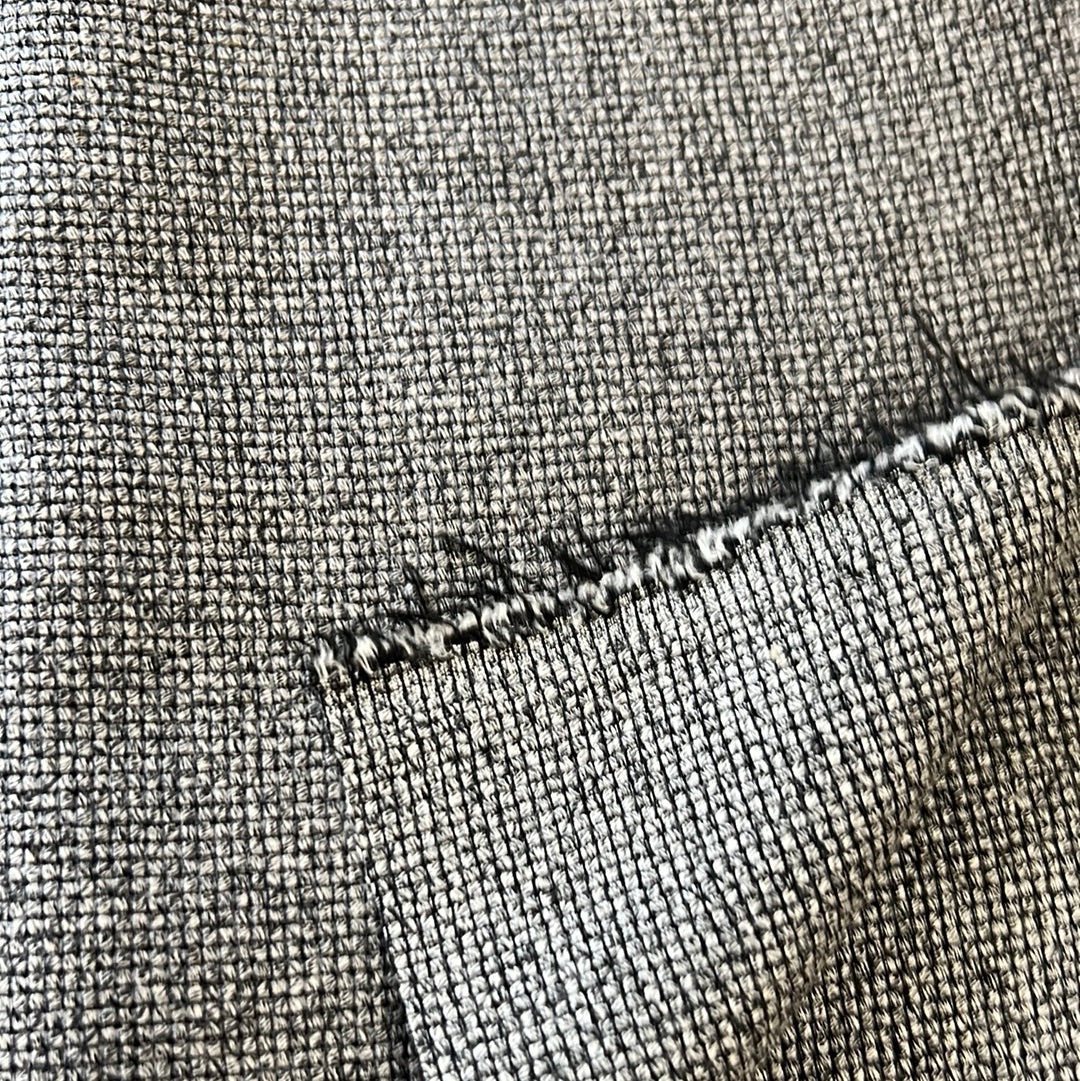 Close-up of charcoal gray fabric with textured weave.
