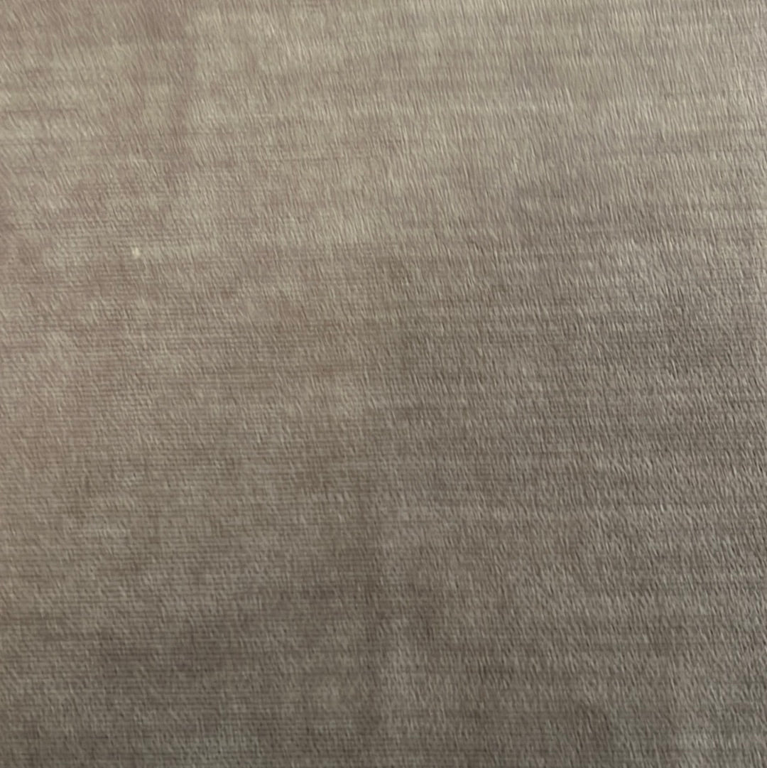 Close-up view of taupe-colored fabric texture.