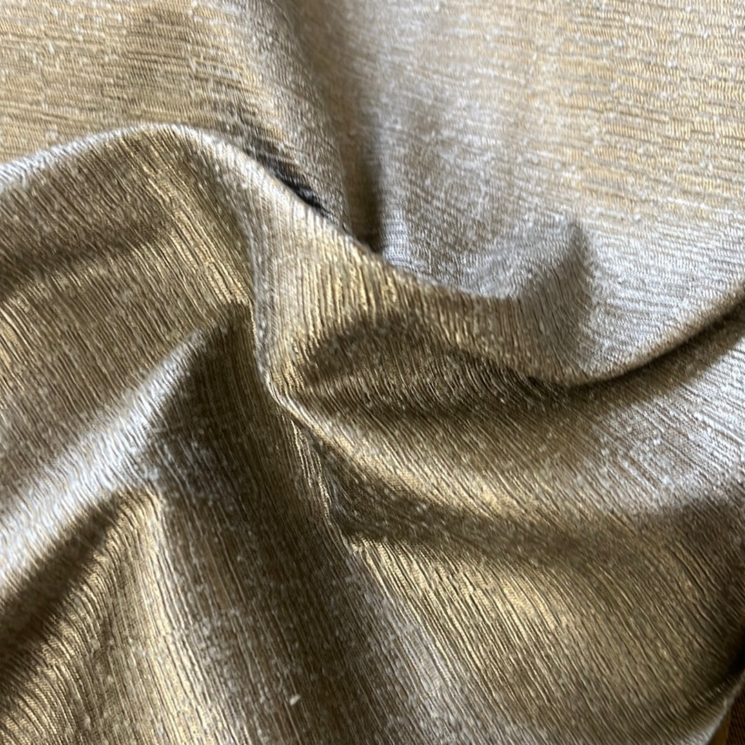 Close-up of luxurious platinum fabric with subtle texture and sheen.