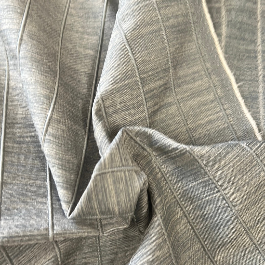 Textured gray fabric with subtle vertical lines, showcasing a soft drape.