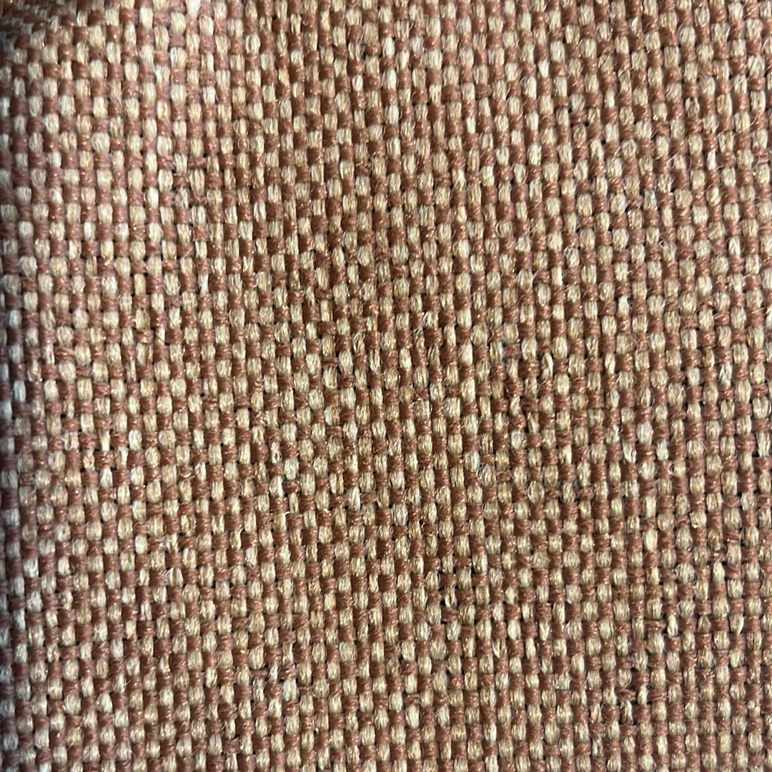 Close-up of woven fabric in earthy brown and beige tones.