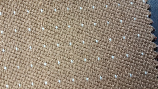 Tan contract fabric swatch, NTM0016, featuring a subtle white dotted pattern.