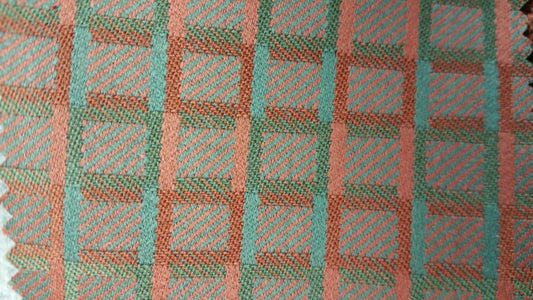 Geo III Pattern Fabric: Teal and coral geometric textile with a woven plaid design.