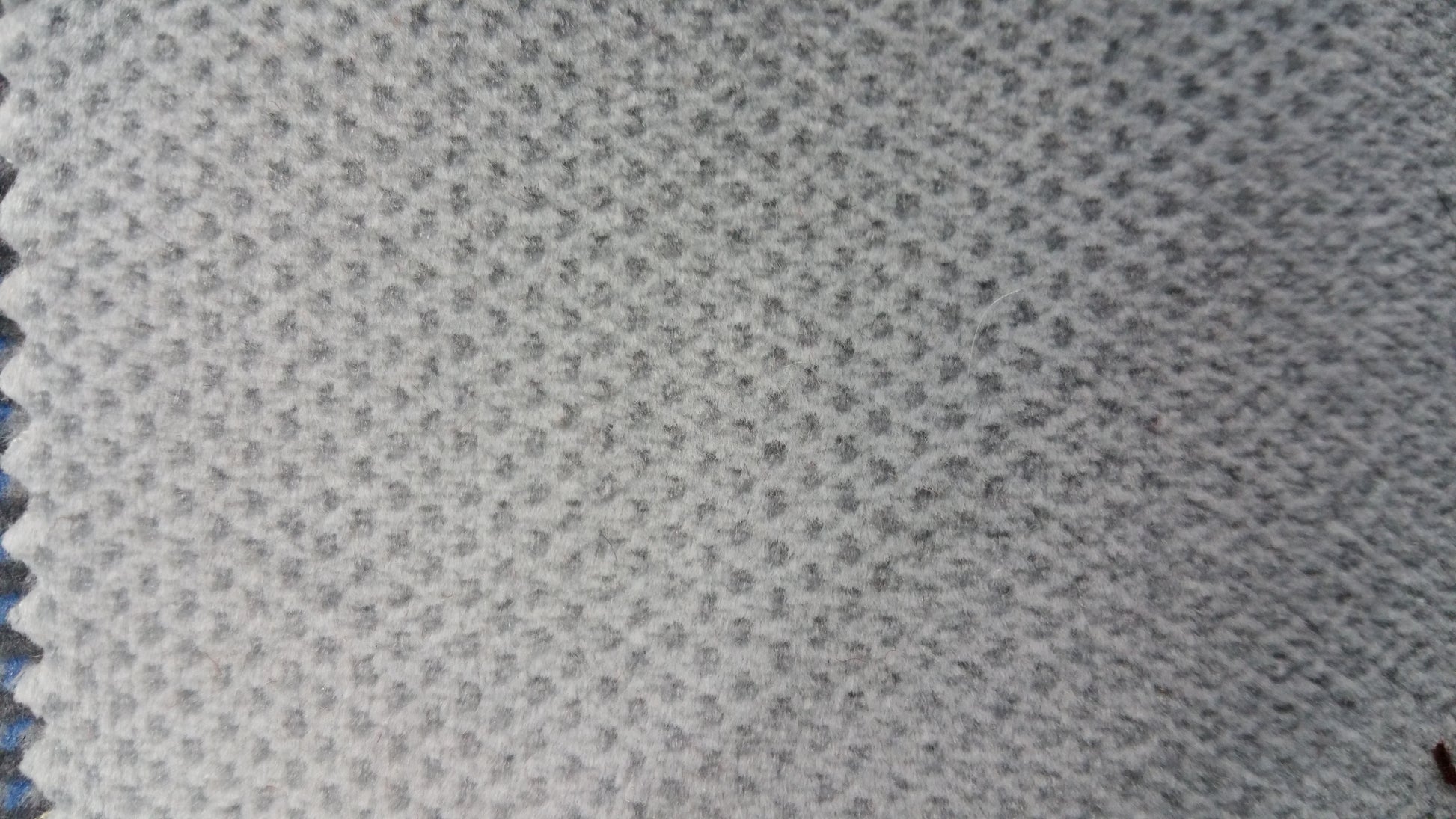 Light gray closeout fabric swatch, textured weave.