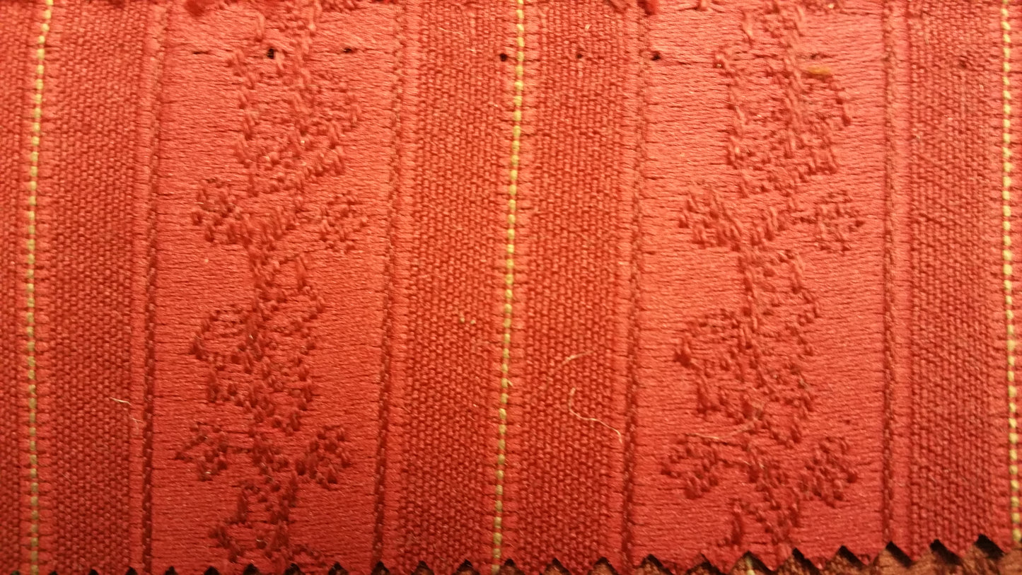 Ring 844 Red Pattern 6117 fabric swatch: Red textured weave with embroidered floral pattern & subtle gold accents.