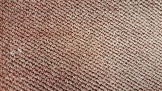Ring 1014 Conversion Van Fabric: Close-up of textured maroon fabric with diagonal pattern.