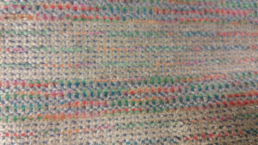 Ring 1368 572: Textured beige rug with multicolored flecks.