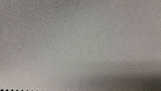 Ring 1482 Magnetic Beige fabric swatch: Close-up of textured, diagonally ribbed beige material.