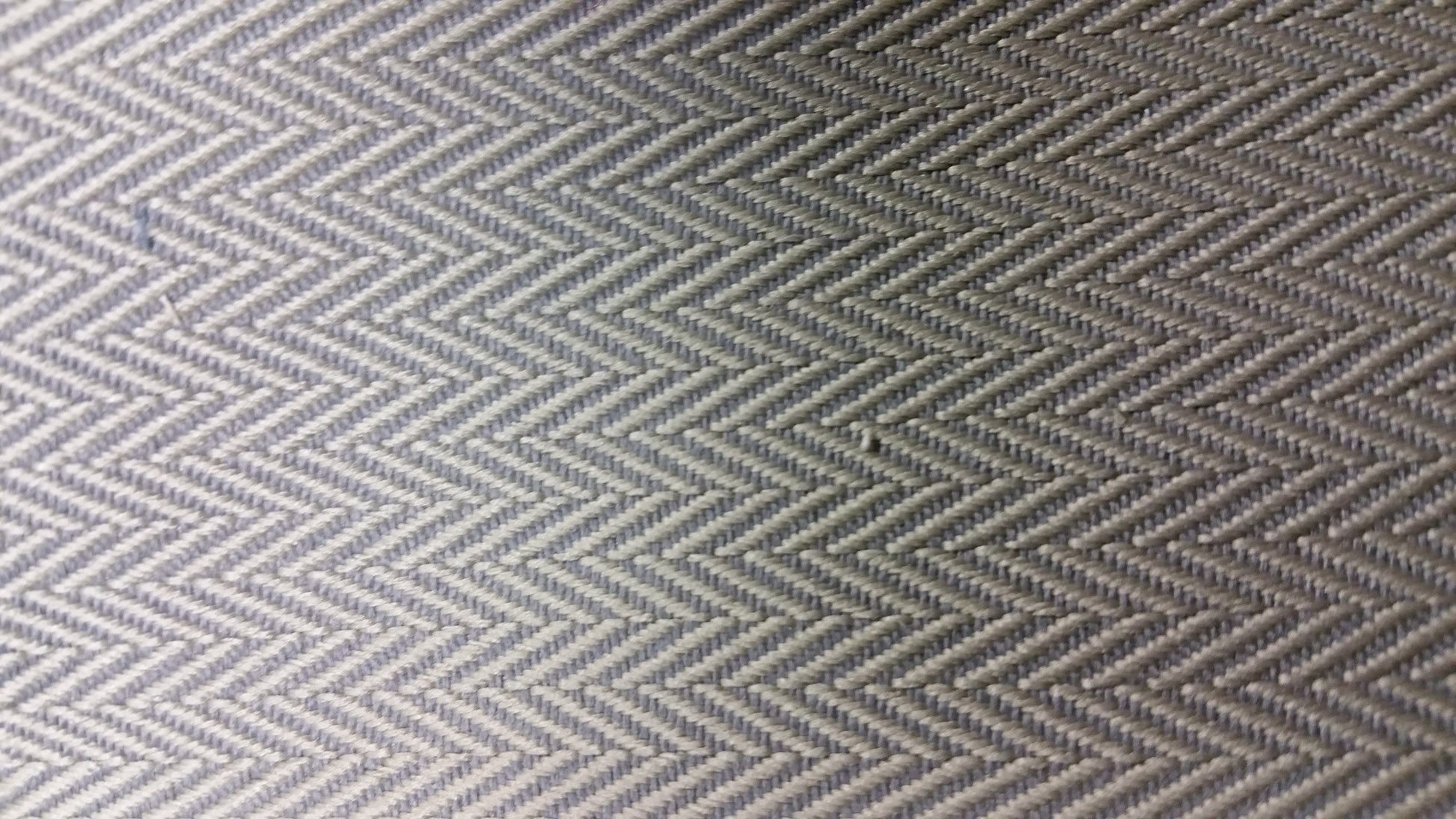 Ring 1541 13114 Flawed: Close-up of textured gray fabric with herringbone pattern.