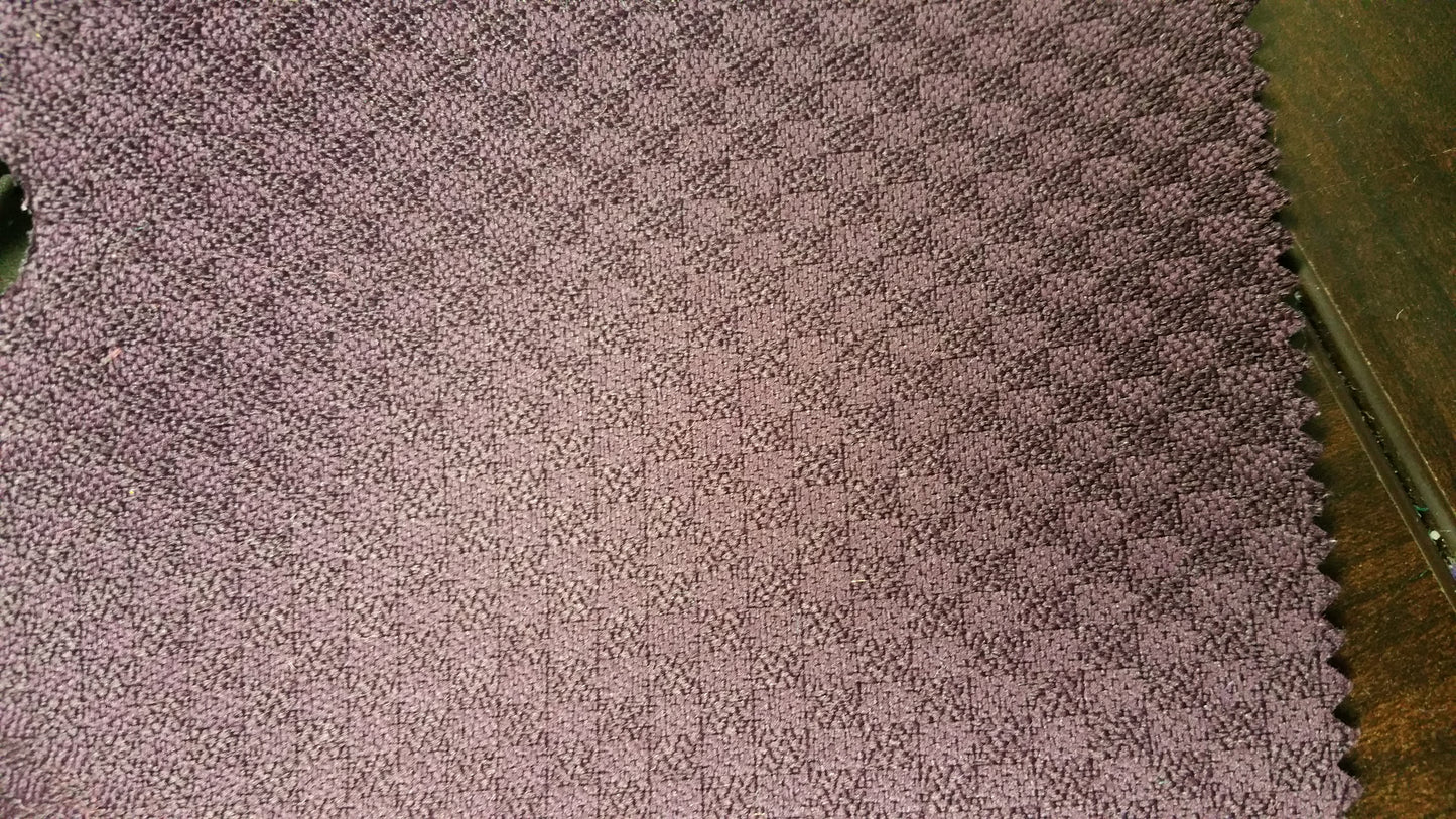 Ring 1547 Momentum Eggplant fabric swatch: close-up of textured, deep purple upholstery material.