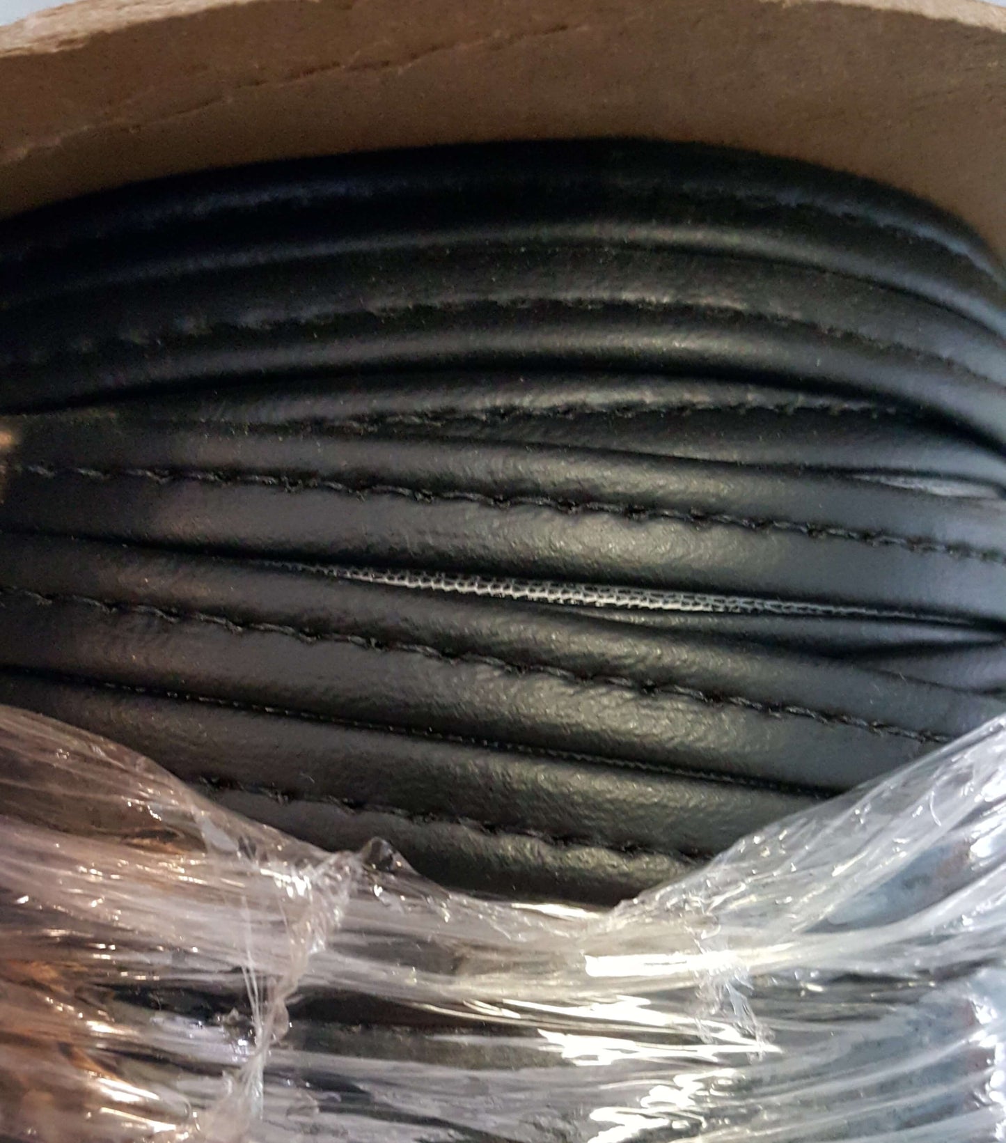 Black Hidem Welt 25yd roll of leather welting, stitched, for upholstery & crafts.