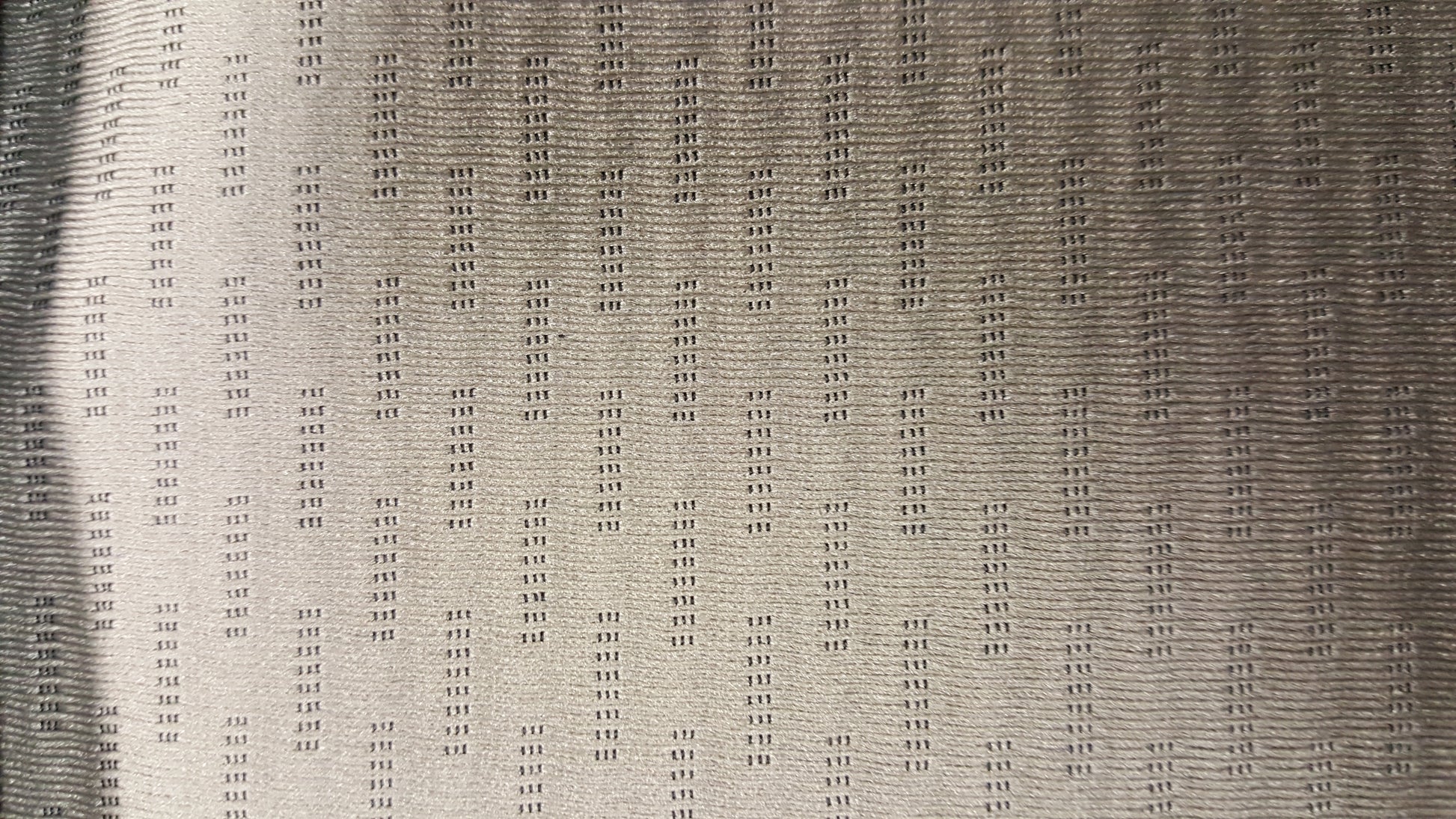 Ring 1639 Calvin Pebble 07-7107 E-series fabric swatch: taupe textured weave with subtle repeating pattern.